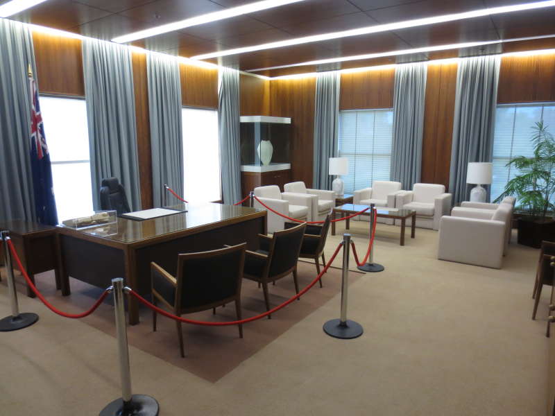 Old version of the Prime Minister's suit, with bright white windows, and a red rope around the PM's desk. 