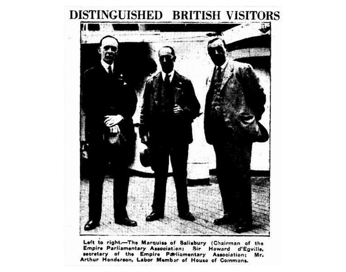 Black and white photograph showing three men identified as The Marquiss of Salisbury, Sir Howard d'Egville and Arthur Henderson, with the heading 'Distinguished British Visitors'.