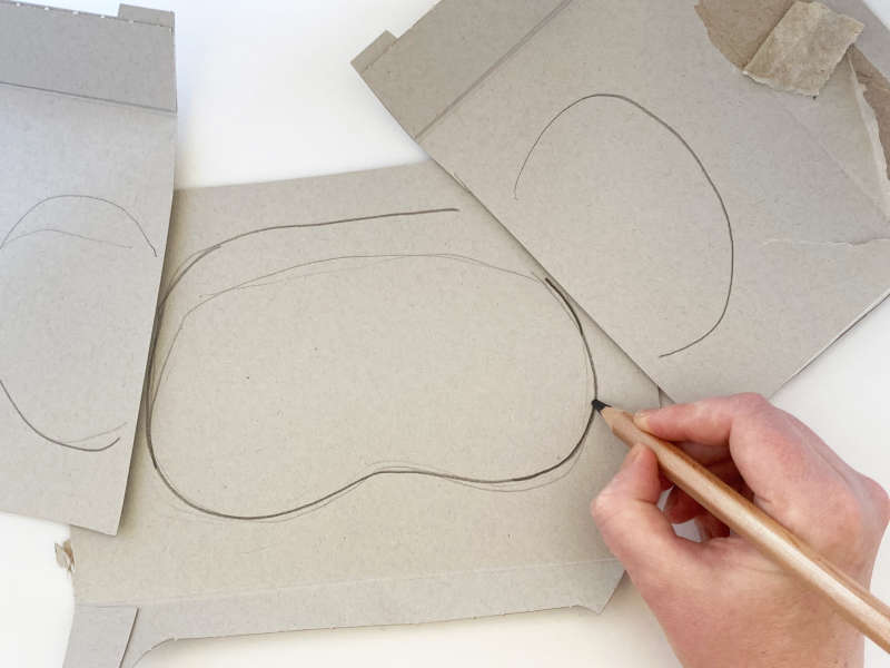 Cardboard with the shape of a koala mask outline. 