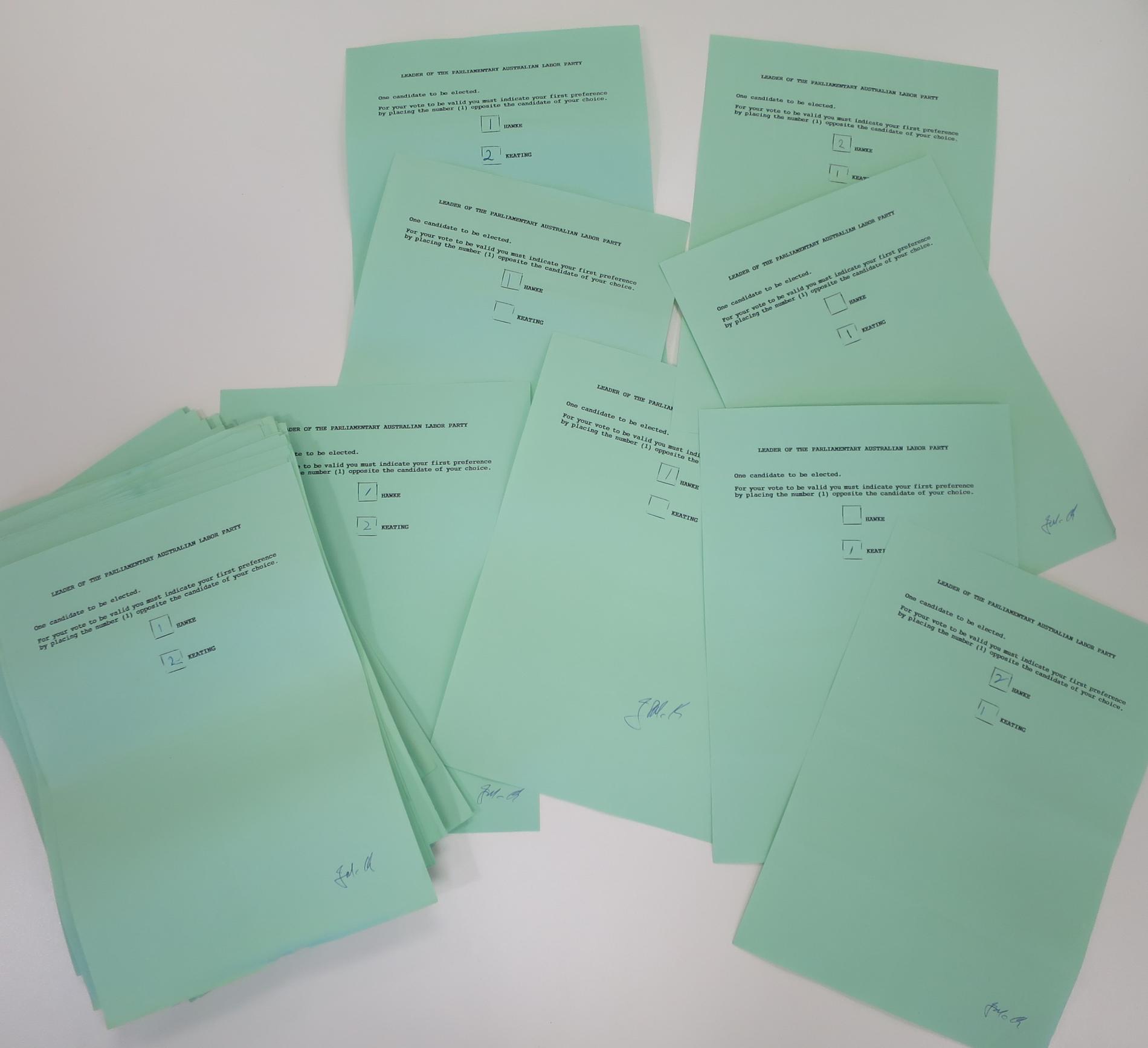 A pile of green ballot papers with two names listed: HAWKE and KEATING.