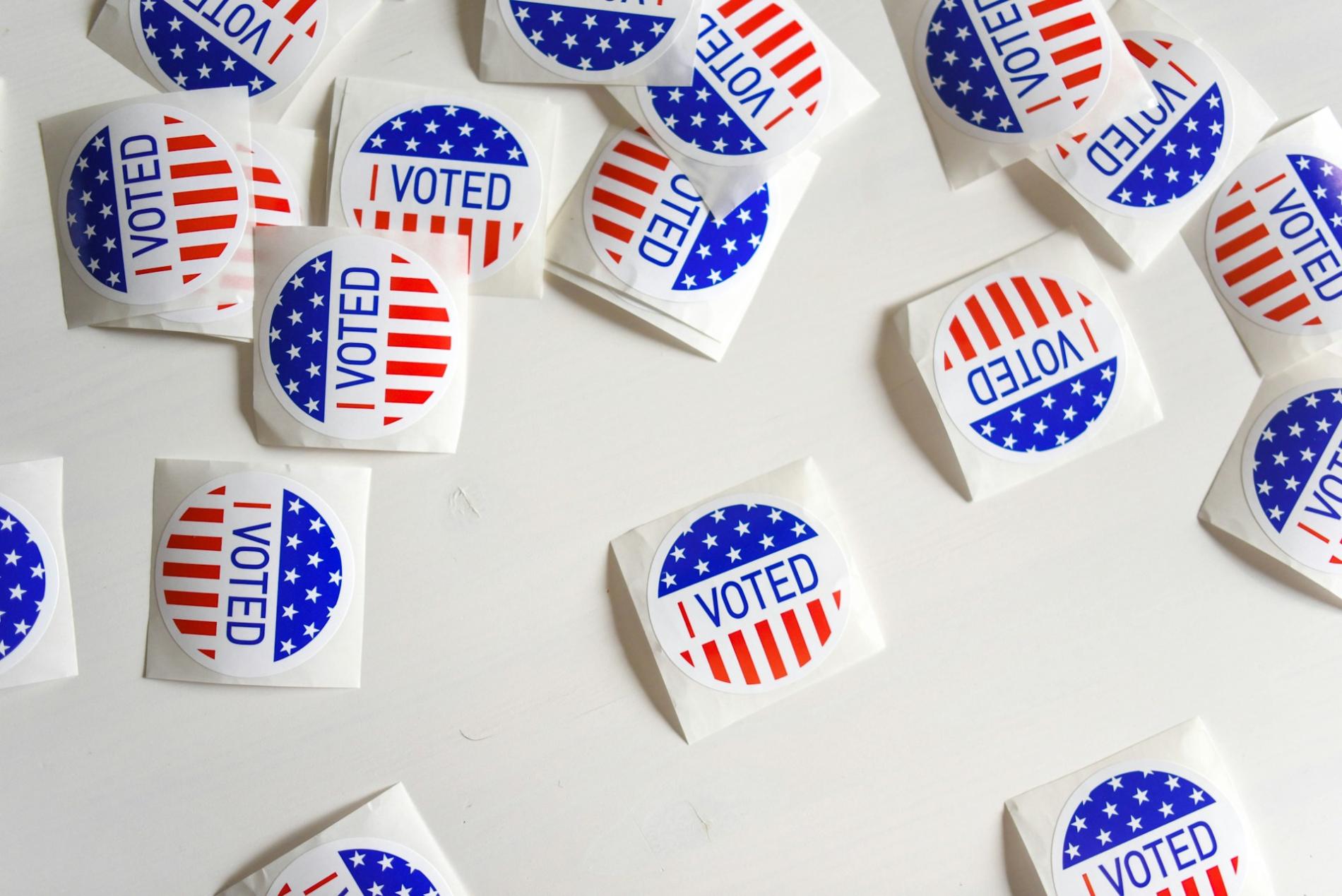 Round stickers depicting the US flag's stars and stripes, with the words 'I voted'.