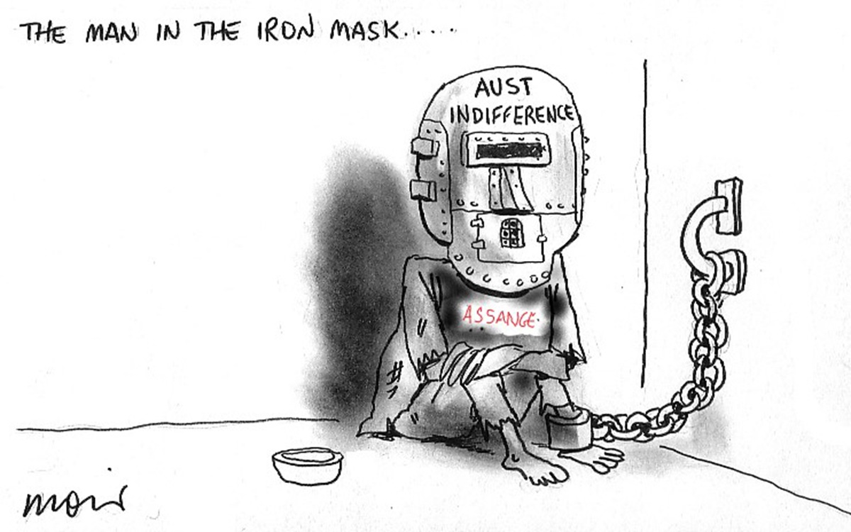 A person, labelled 'Assange', sits chained to a wall and wearing an iron mask that reads 'Aust indifference'. Text reads, 'The man in the iron mask…' 