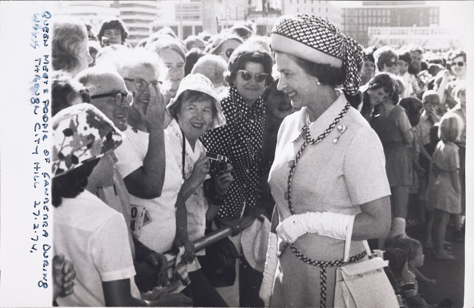 Queen Elizabeth II meets people during a walk through Canberra city. Queen Elizabeth II meets people during a walk through Canberra city.
