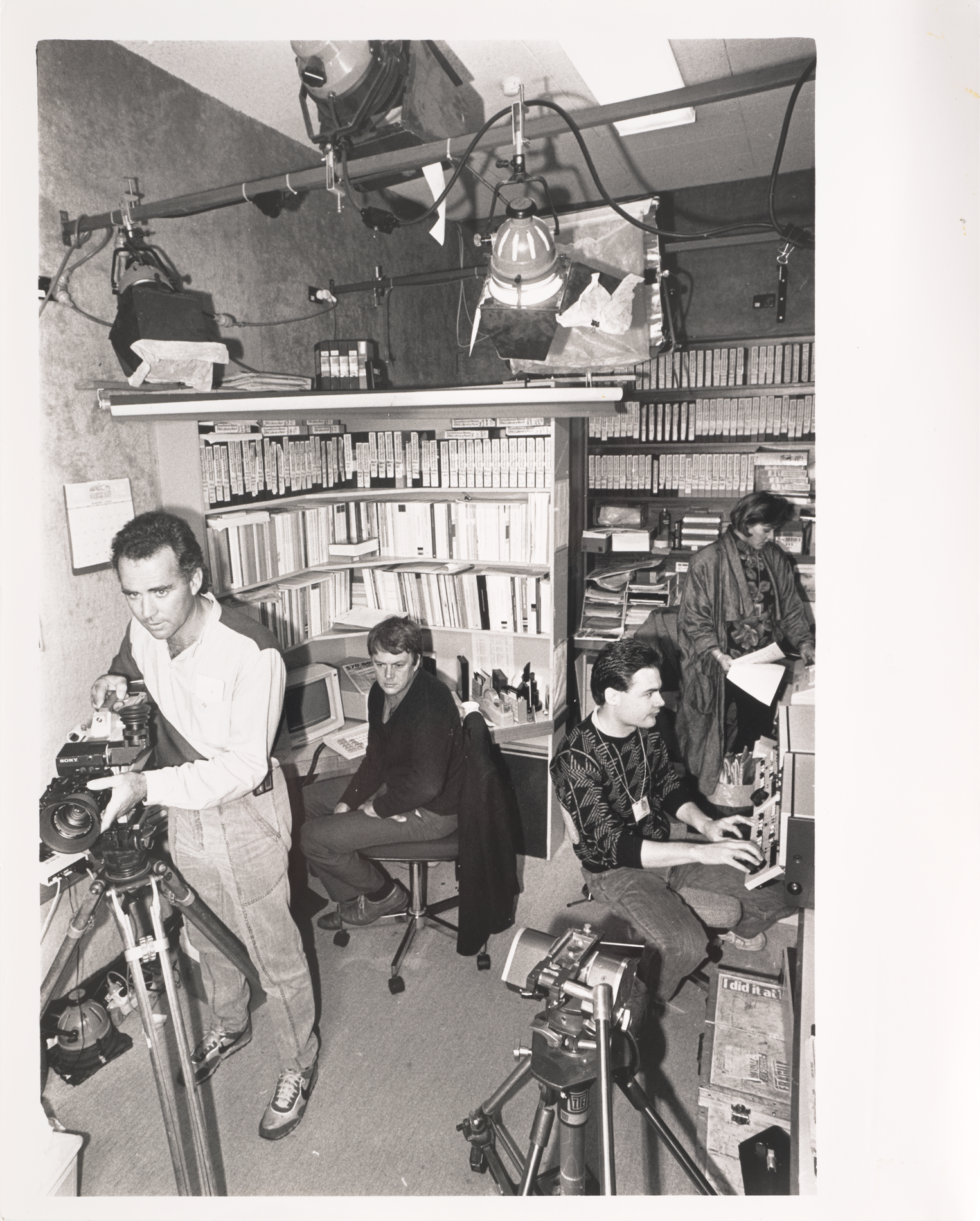 Four television studio workers in a small, cramped television studio in Parliament House