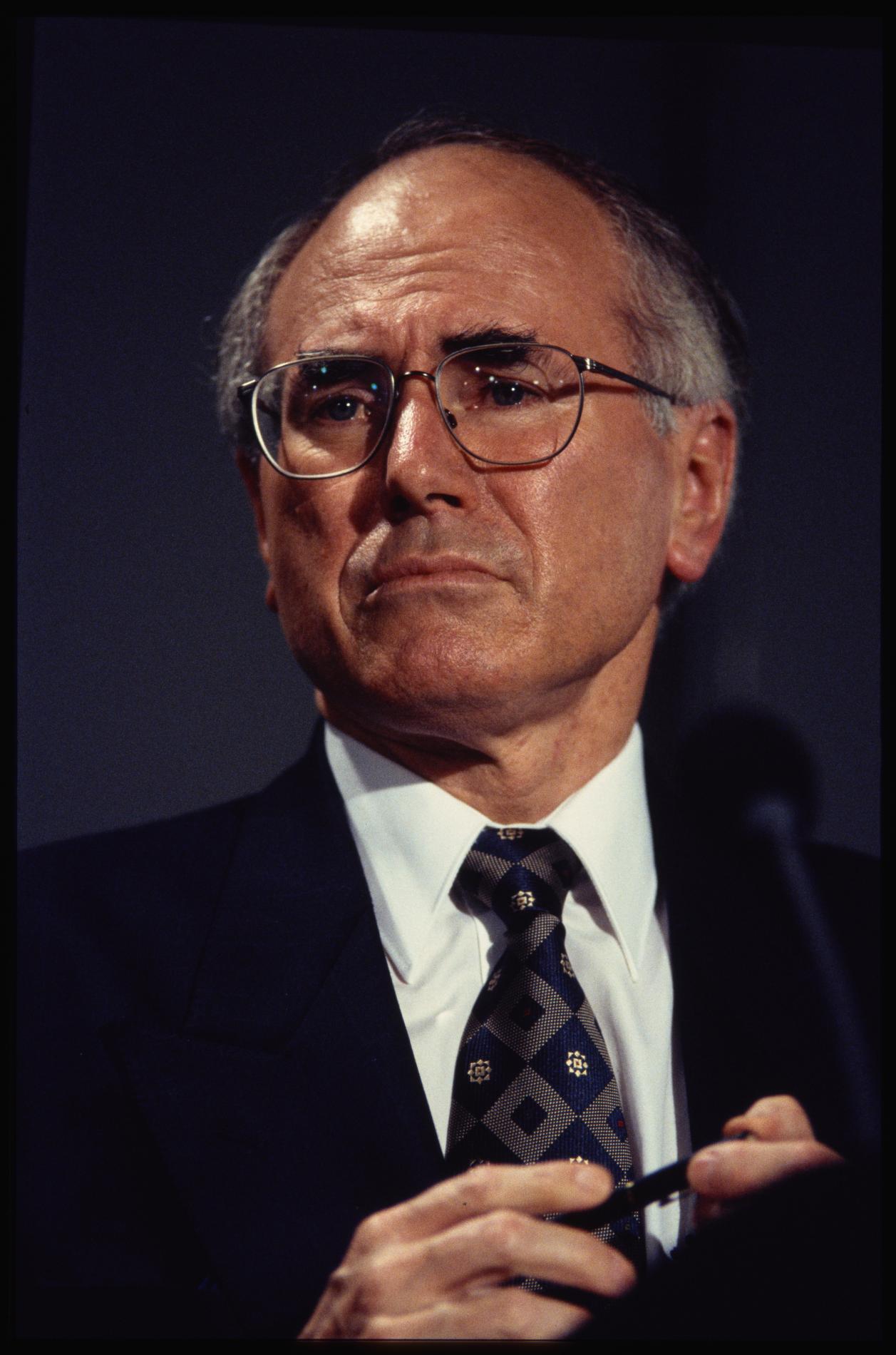 A portrait image showing former prime minister John Howard.