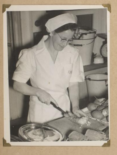An image of a chef cutting up lobster in the kitchen at Old Parliament House.