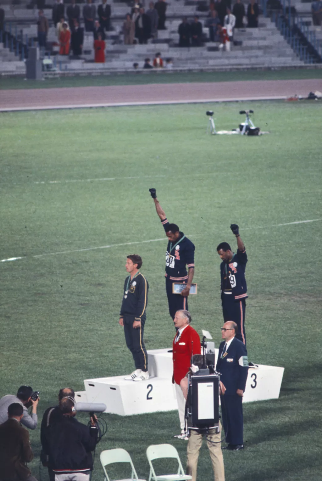 This famous photo shows Peter Norman standing silently as his two American friends give a salute for civil rights.