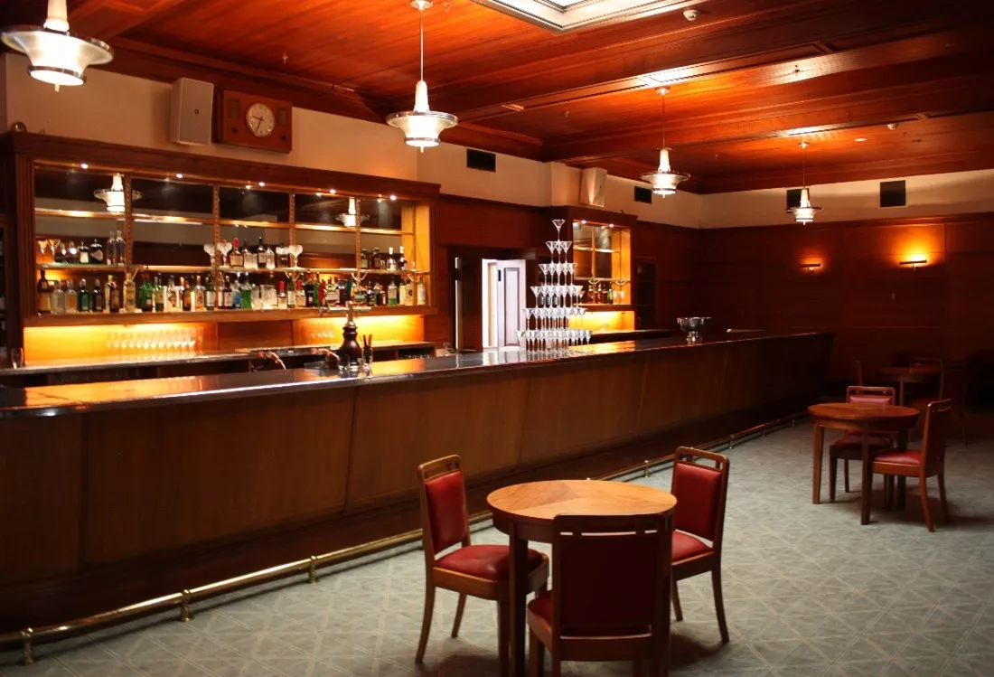 A wood panelled bar.