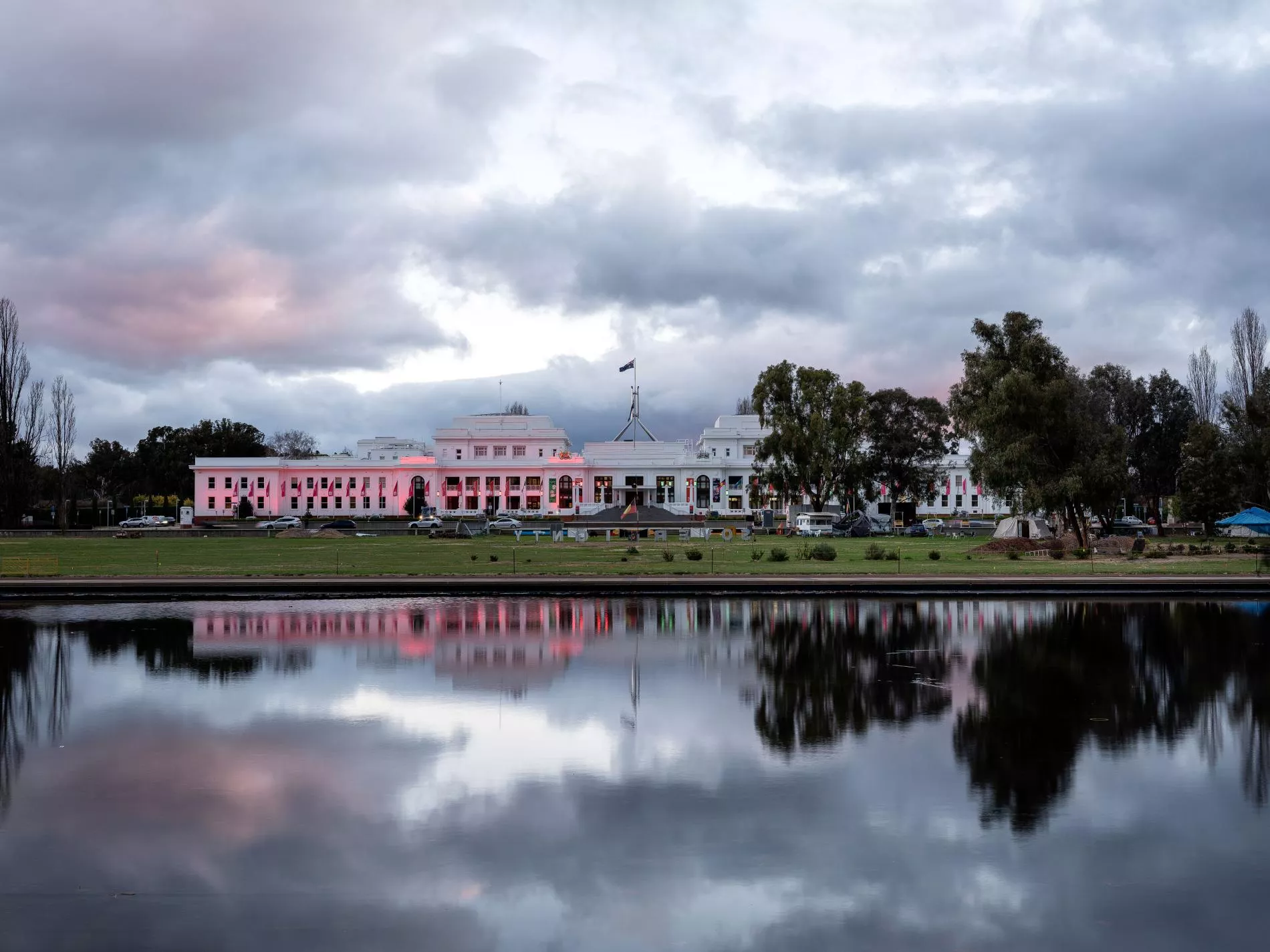 The front of Old Parliament House in the evening lit up with pink lights. The front of Old Parliament House in the evening lit up with pink lights.