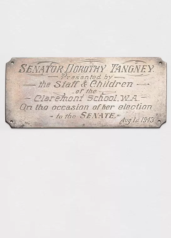 Photograph of a commemorative plaque siginifying Dorothy Tangney's election to the senate.