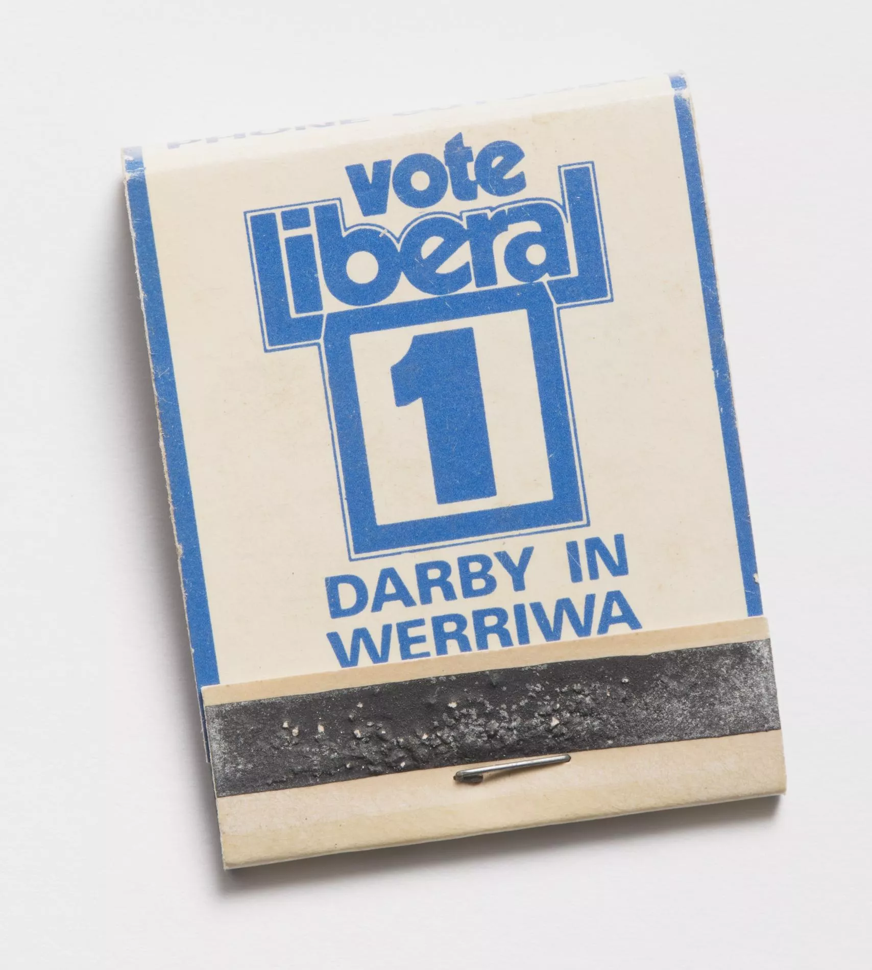 Photograph of a small matchbook reading "Vote liberal 1 Darby in Werriwa"