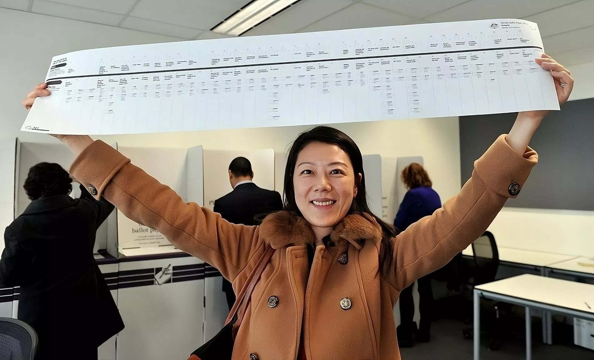 Photograph of a person holding a senate paper.