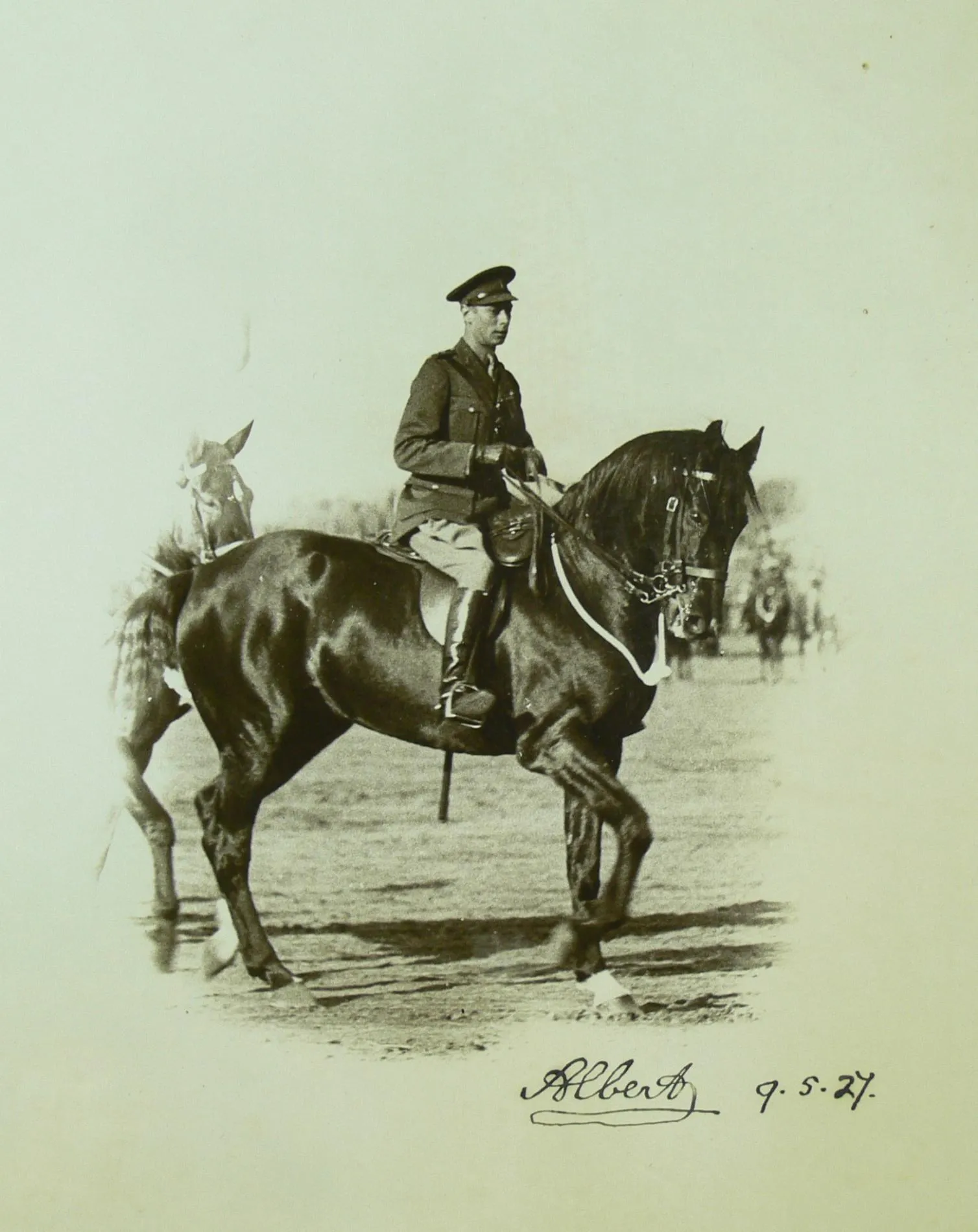 The Duke of York rides a horse in a park in Canberra. The image is signed 'Albert' with the date 9.5.27. The Duke of York rides a horse in a park in Canberra. The image is signed 'Albert' with the date 9.5.27.