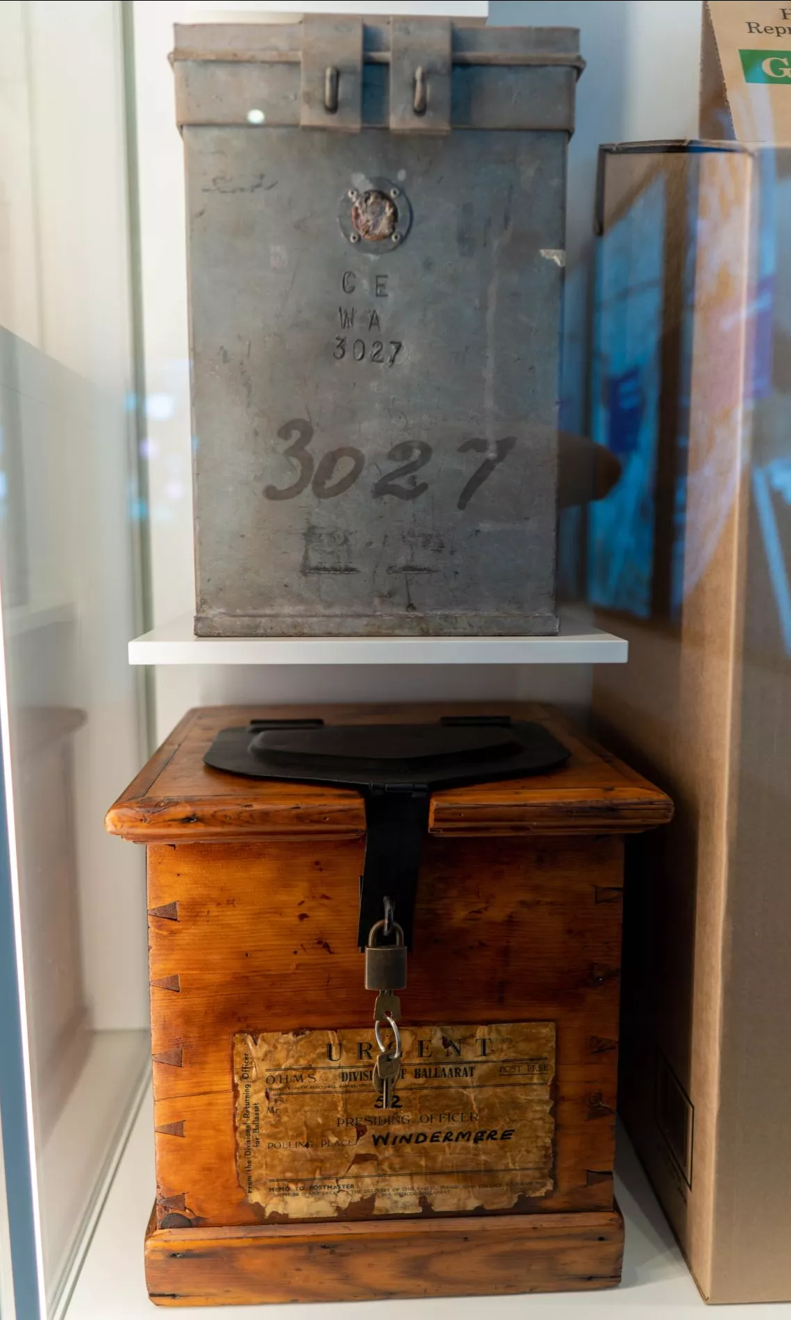 Two old and worn looking square ballot boxes Two old and worn looking square ballot boxes