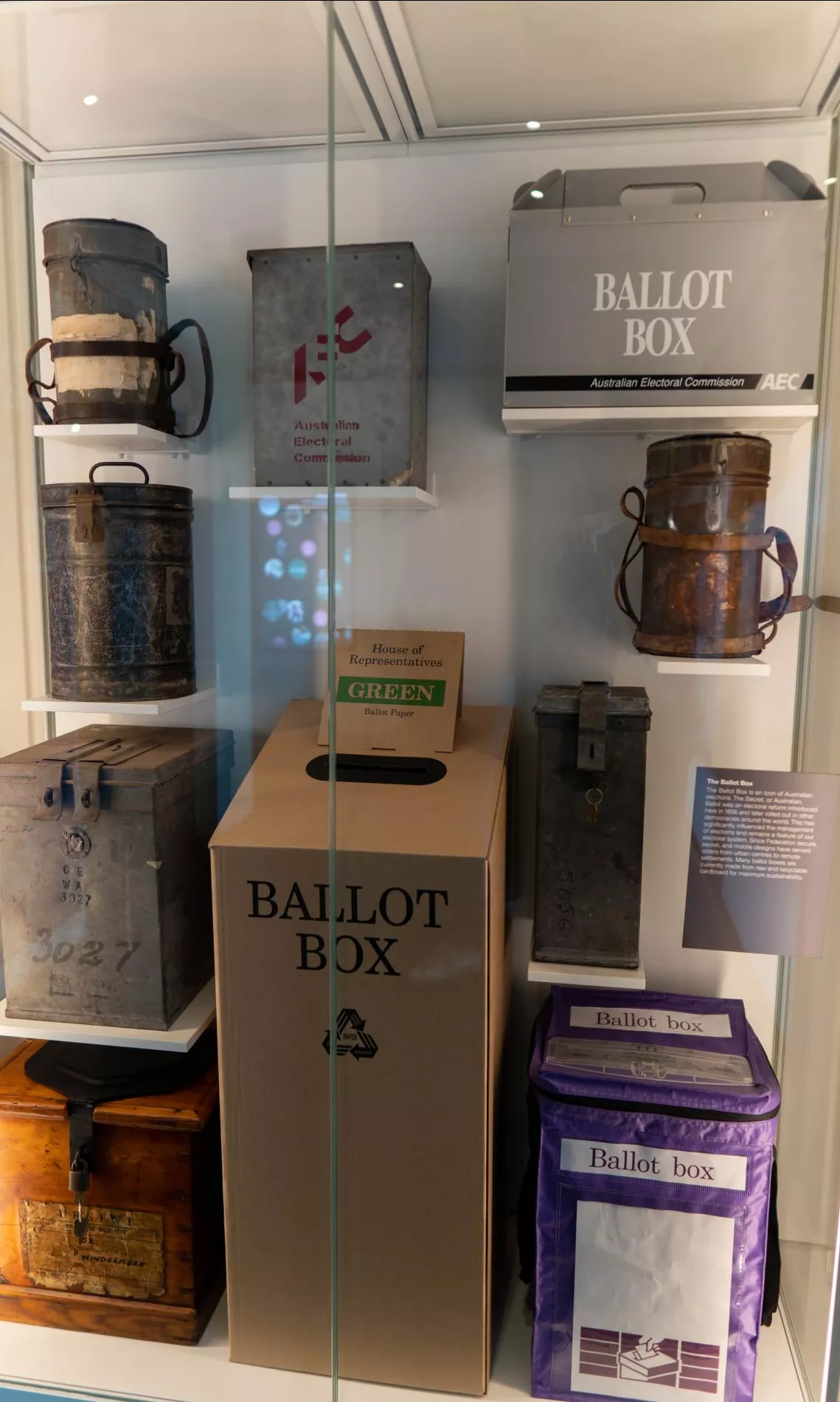 A glass showcase featuring many different types of ballot boxes used throughout Australian history. A glass showcase featuring many different types of ballot boxes used throughout Australian history.