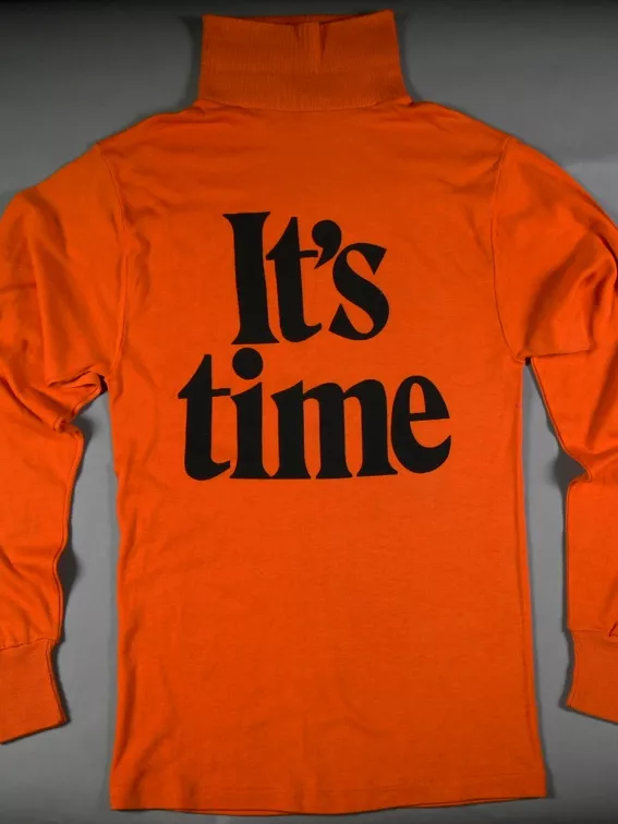 An orange skivvy with the words 'It's time' in bold black letters.