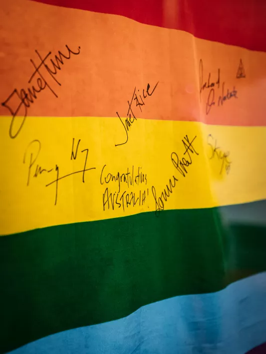 A signed rainbow flag from the exhibition