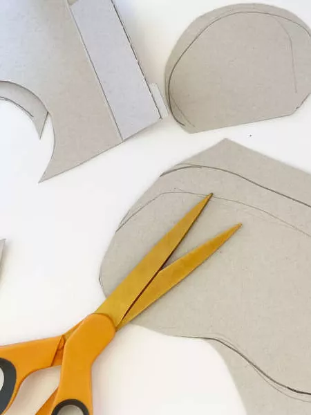 A piece of cardboard cut out into a koala shape. A piece of cardboard cut out into a koala shape.