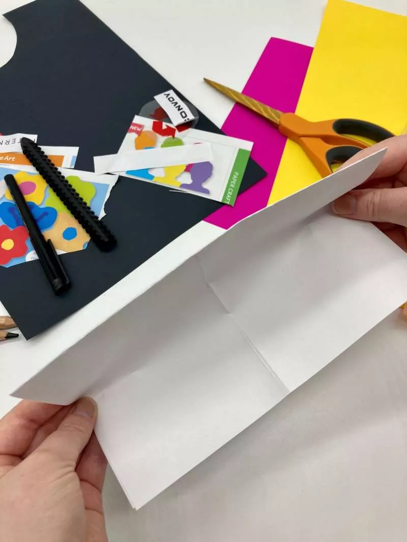 Two hands fold a piece of paper. Two hands fold a piece of paper.