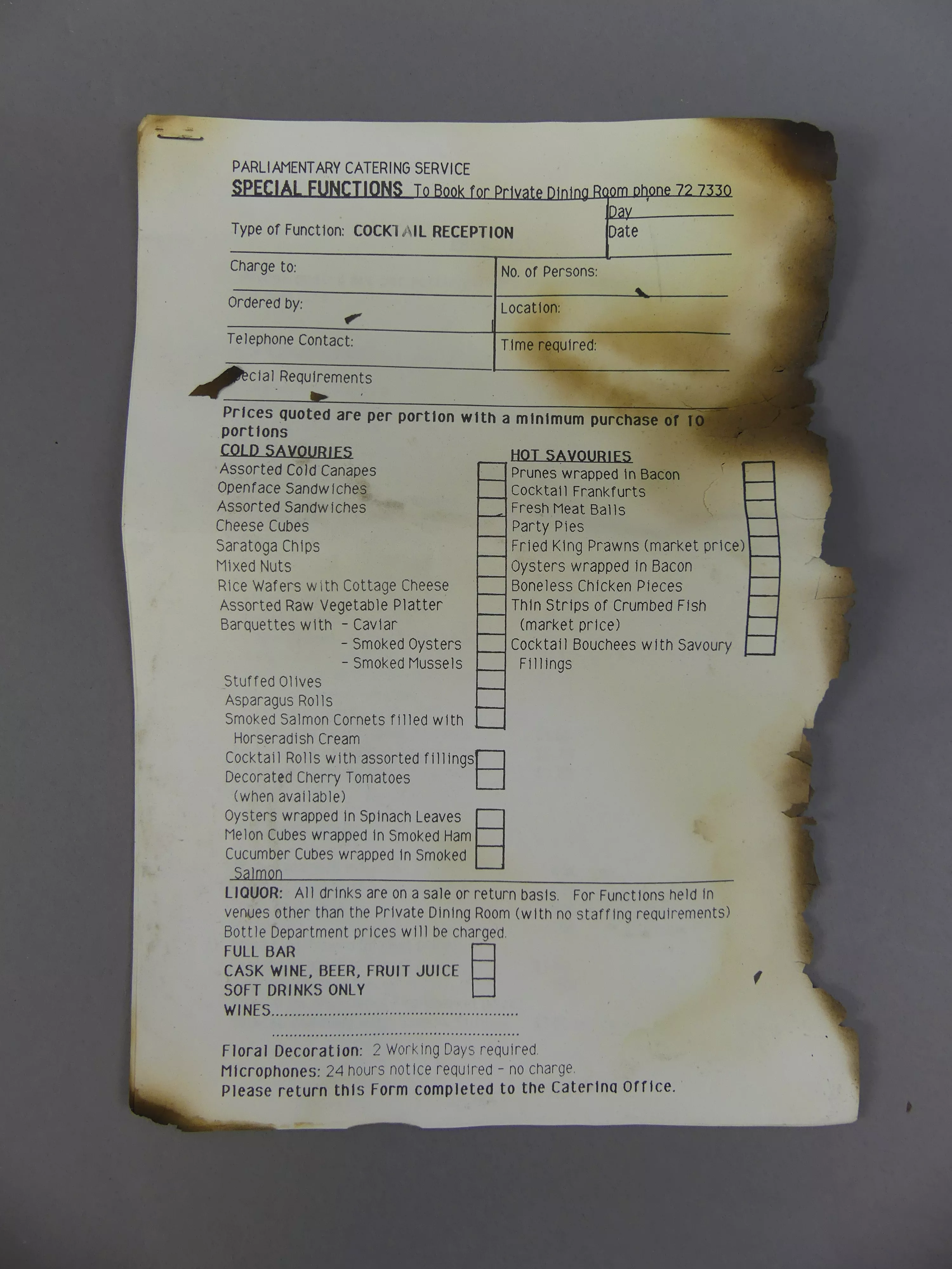 Catering form for a Cocktail reception at Parliament House, slightly burnt on one side.