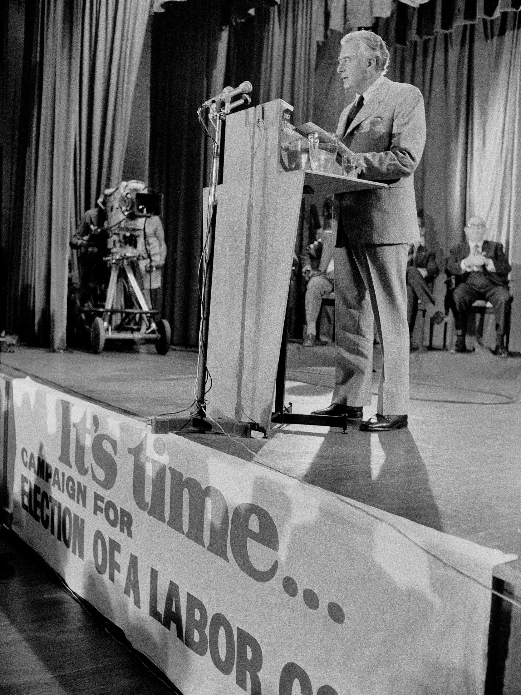 A relaxed Gough Whitlam and a smiling Patricia Amphlett posing together in t-shirts emblazoned with the words ‘It’s time’. 