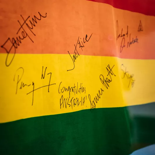 A signed rainbow flag from the exhibition