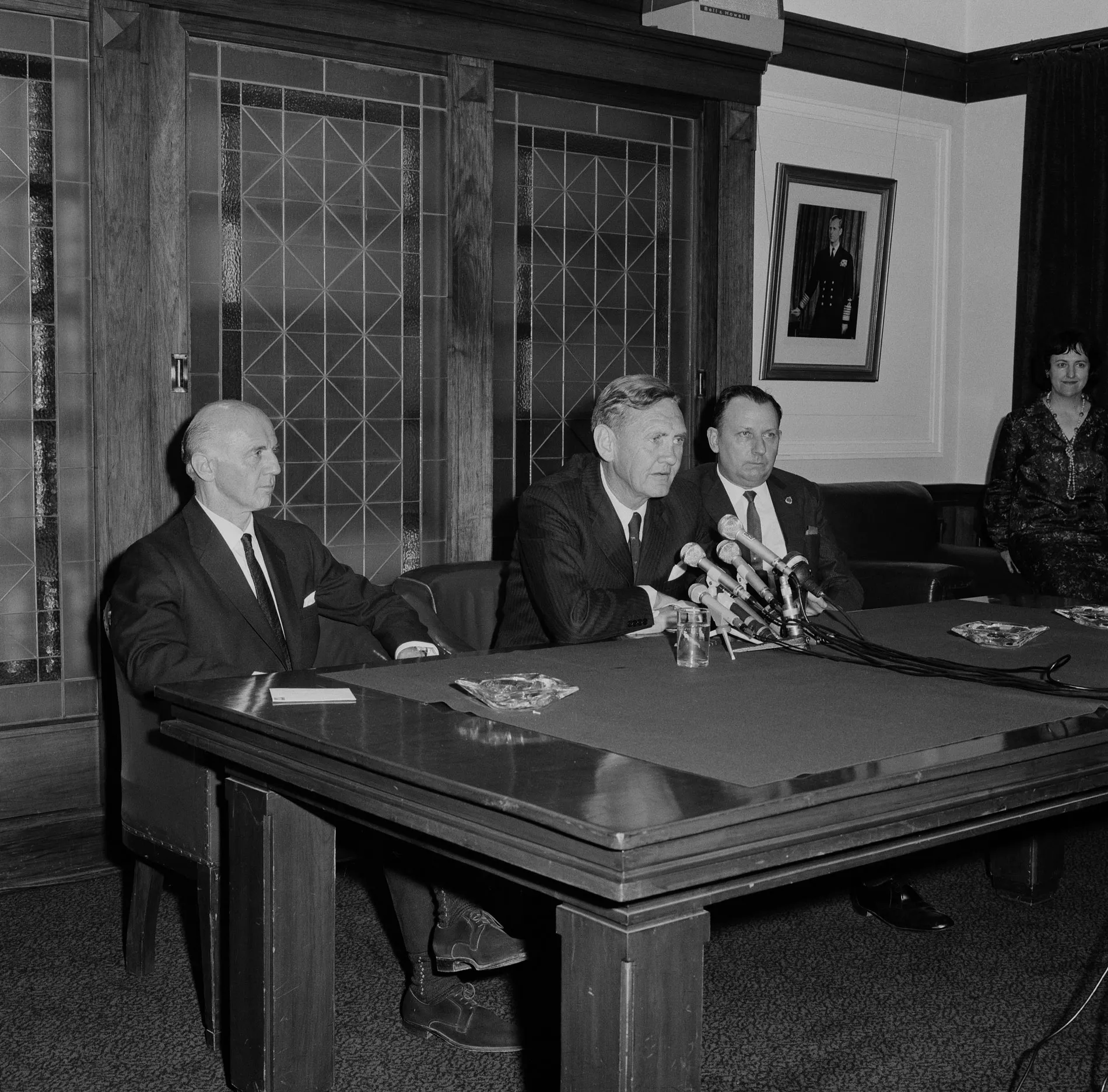 John Gorton addresses the press in the Senate Opposition Party Room on 9 January 1968 as newly elected leader of the Liberal Party following the death of Harold Holt. The next day he was sworn in as prime minister. Billy McMahon and Dudley Erwin sit beside Gorton.
Photograph NAA: A1200, L68176 Former Australian Prime Minister John Gorton and two other men sit at a table with microphones in the Senate Opposition Party Room in Old Parliament House.