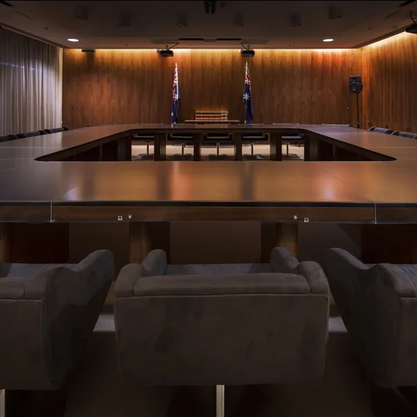 The Cabinet Room at Old Parliament House featuring a large table with chairs. The room is wood panelled.