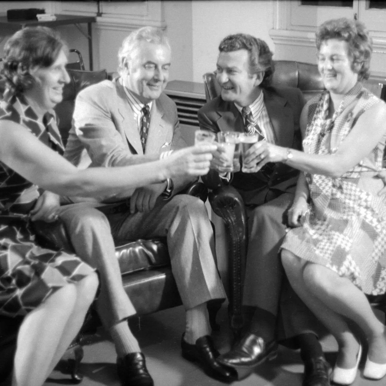 Gough and Margaret Whitlam clink their glasses with Bob and Hazel Hawke.