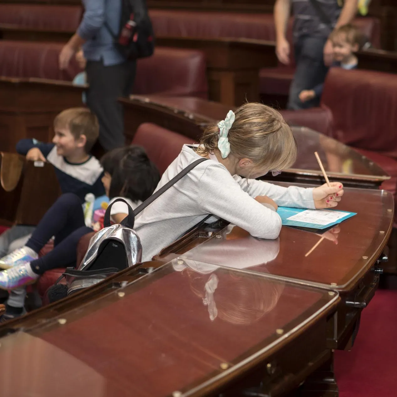 A young visitor working on an activity on one of the trails.