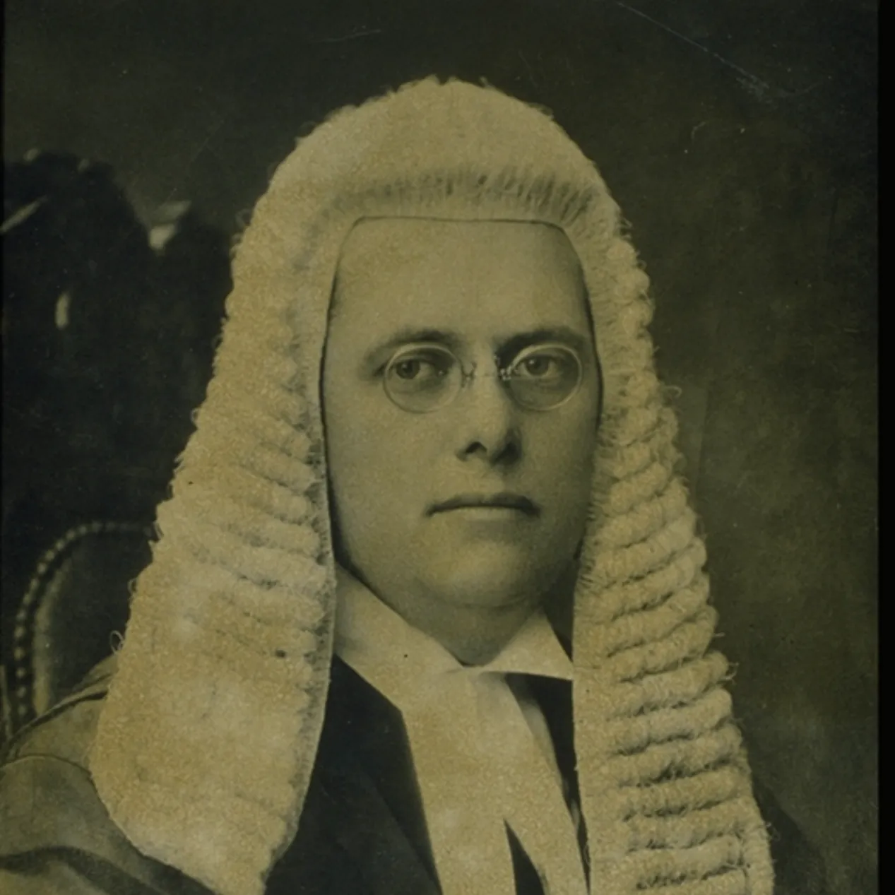 A black and white image of Herbert Evatt sitting, wearing the wig work by the Speaker of the House of Representatives.