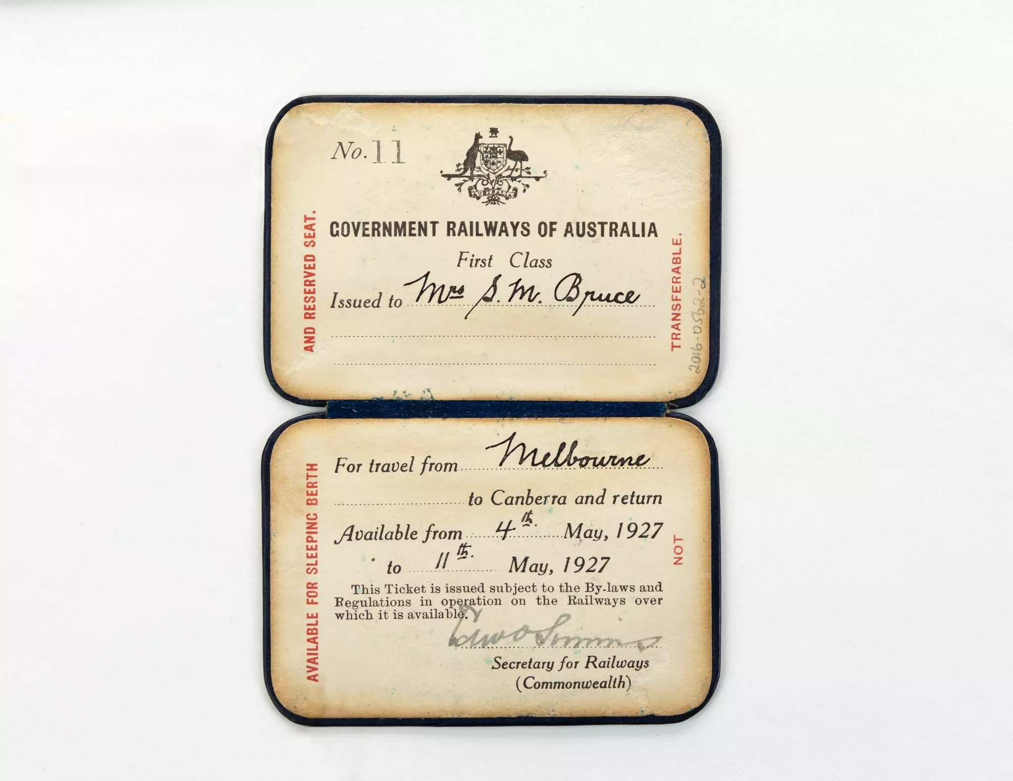 An old paper rail pass with the words 'Government Railways of Australia, First Class, Issued to Mrs S.M. Bruce for travel from Melbourne to Canberra and return Available 4th May,1927 to 11th May, 1927.