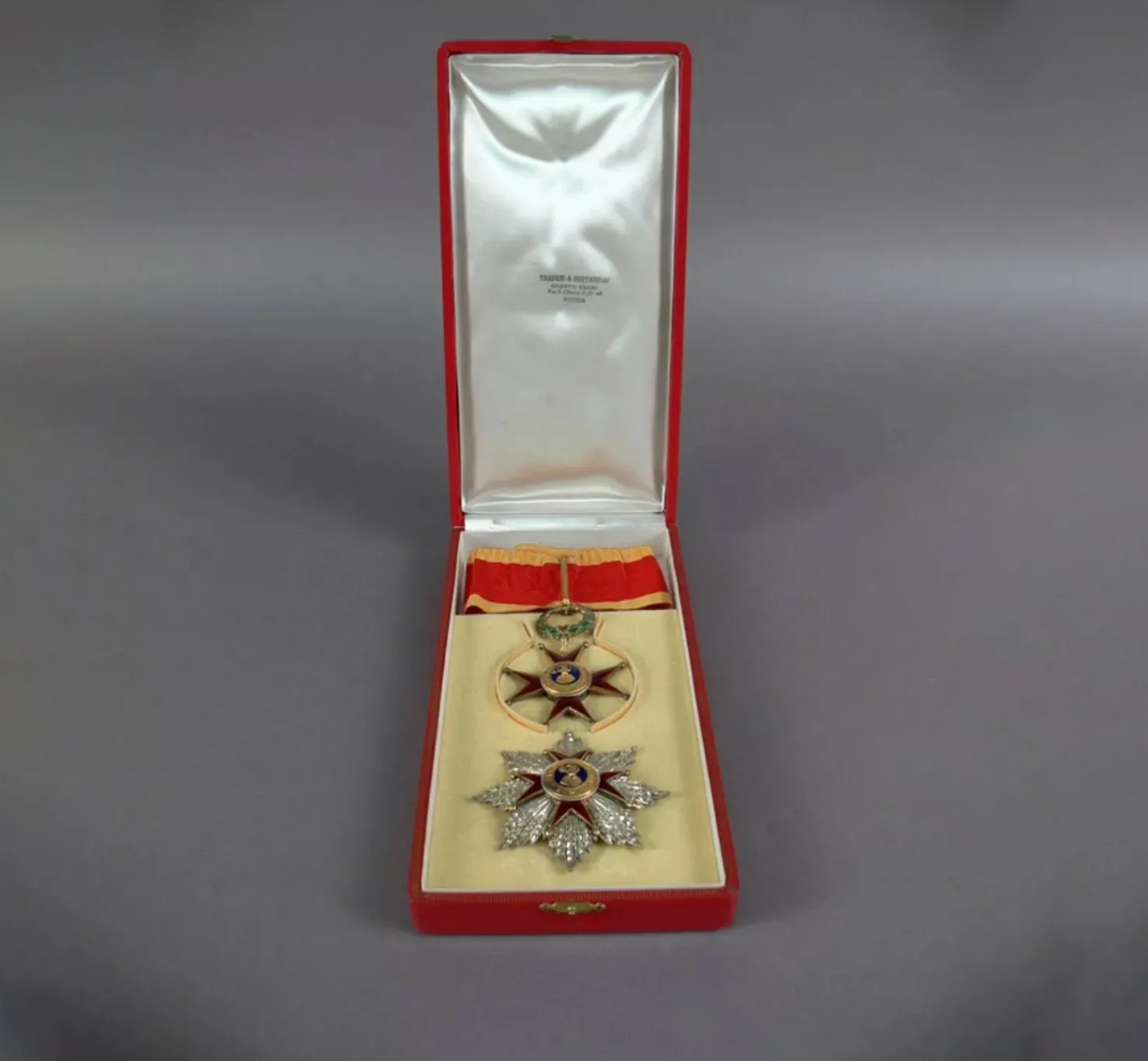 Regalia of a papal knight, two medals of a red cross kept in a silk-lined red box.