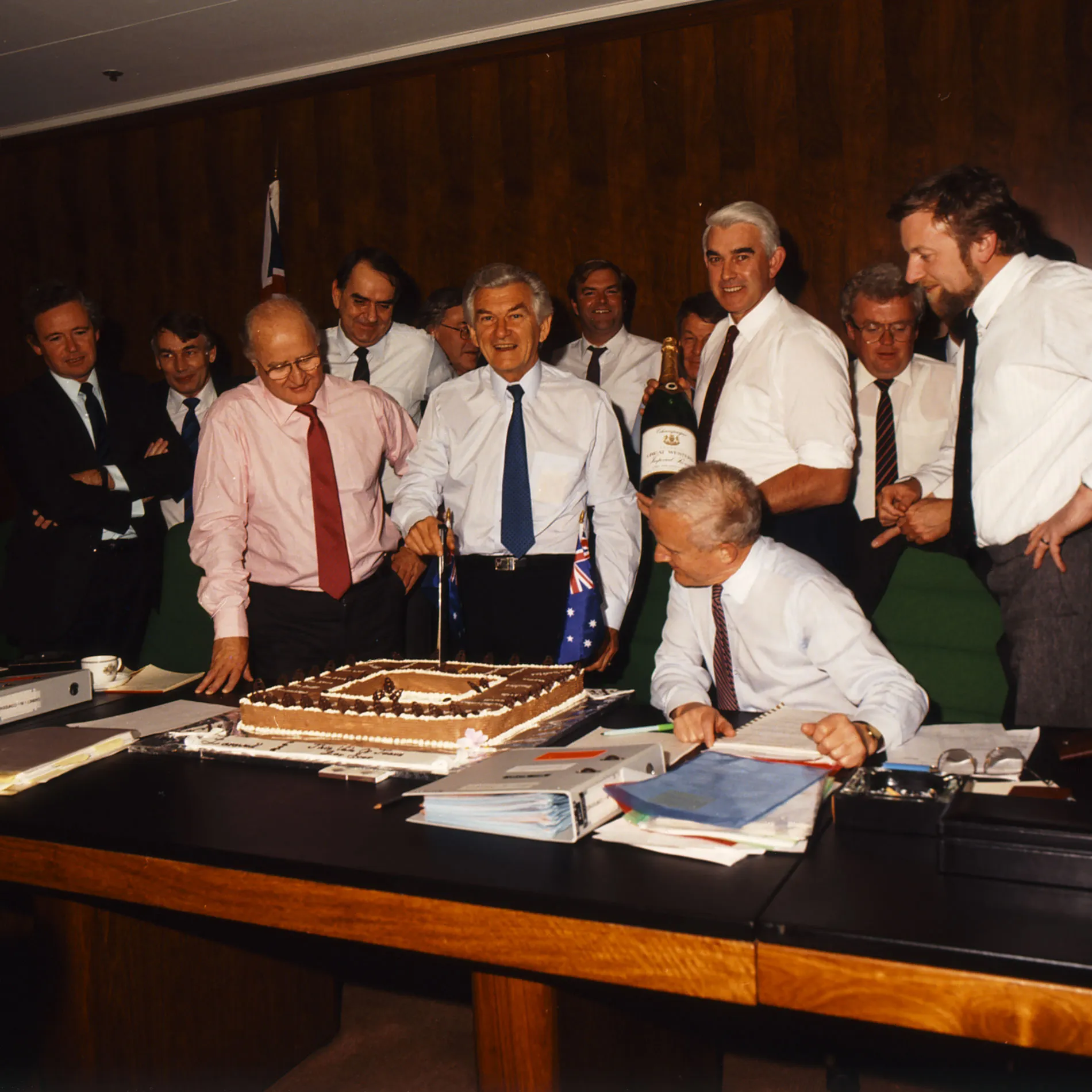 Bob Hawke cuts a cake in front of his members of Cabinet in the Cabinet Room at Old Parliament House. Bob Hawke cuts a cake in front of his members of Cabinet in the Cabinet Room at Old Parliament House.